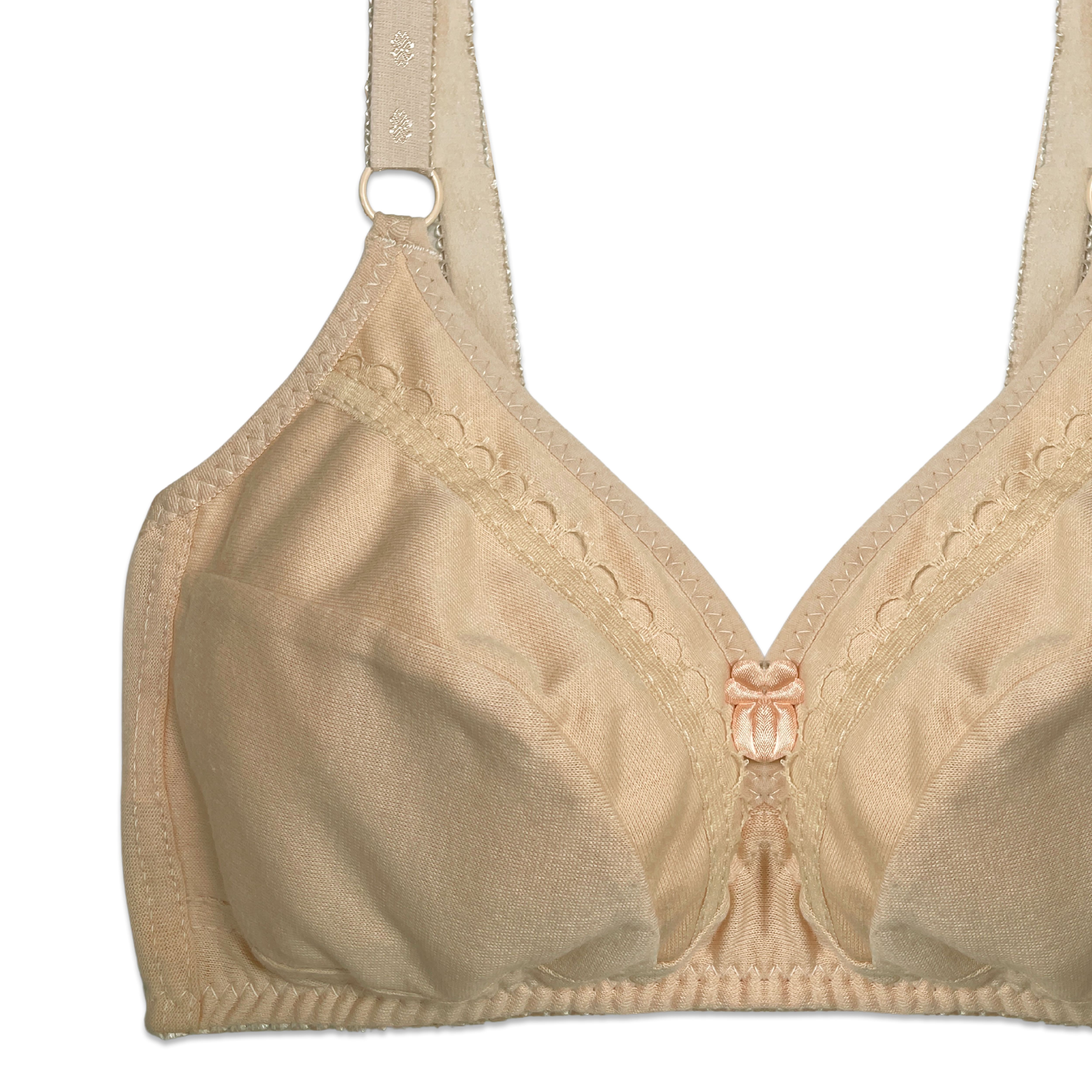 Beige bra with lace details on a white background